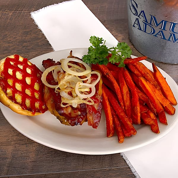 Big Al's Pub & Grubberia's BBQ burger with caramelized onions, sweet potato fries, and a Samuel Adams bucket.